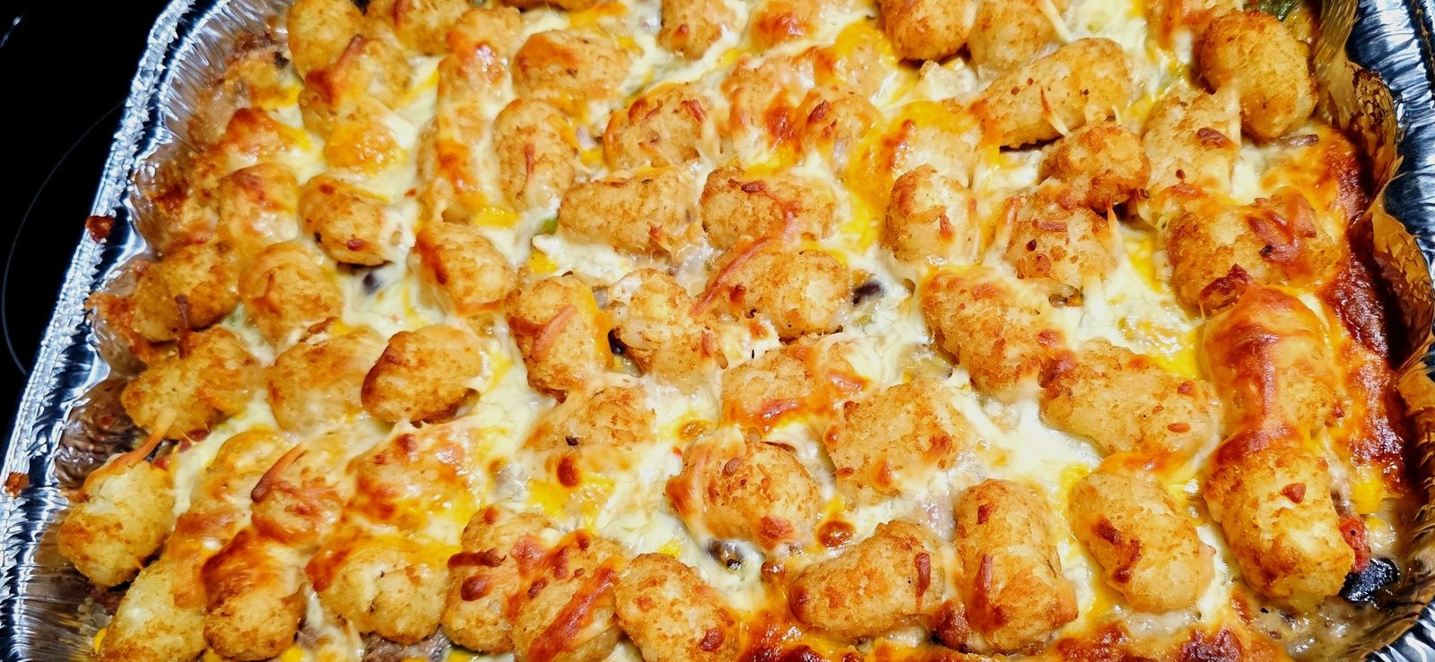 Southwest cowboy casserole with a golden cornbread-style crust, fresh from the oven